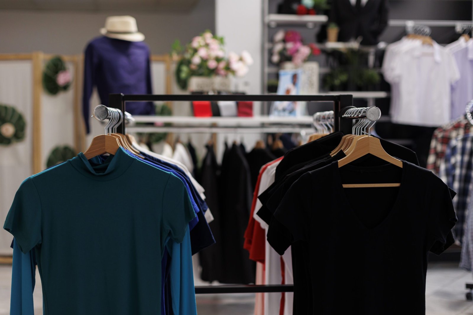 Modern boutique with colorful t-shirt and stylish accessories. Empty clothing store filled with new fashion collection and fashionable clothes waiting for customers to come and shop